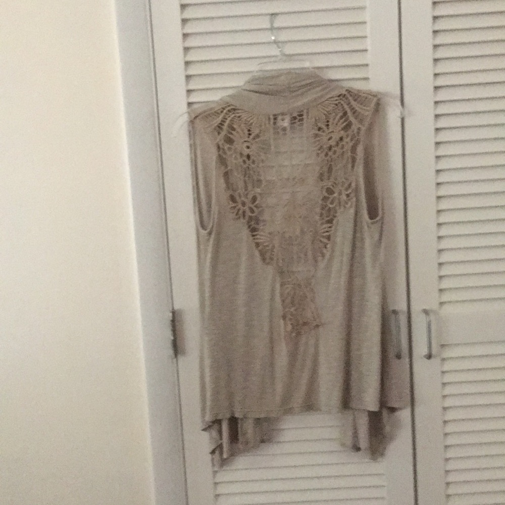 Cute Beige sleeveless jacket.